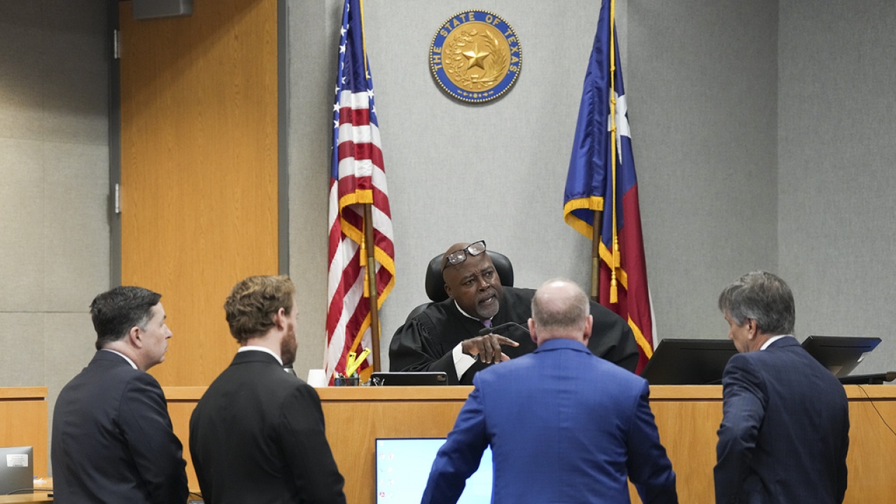 Judge Clifford Brown speaks with the defense and prosecution during Daniel Perry's sentencing hearing
