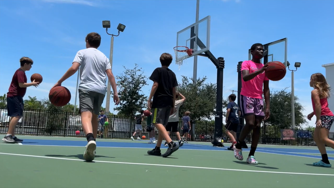 Children play basketball at Brighthouse Day Camp in west Boynton Beach on June 28, 2023.PNG