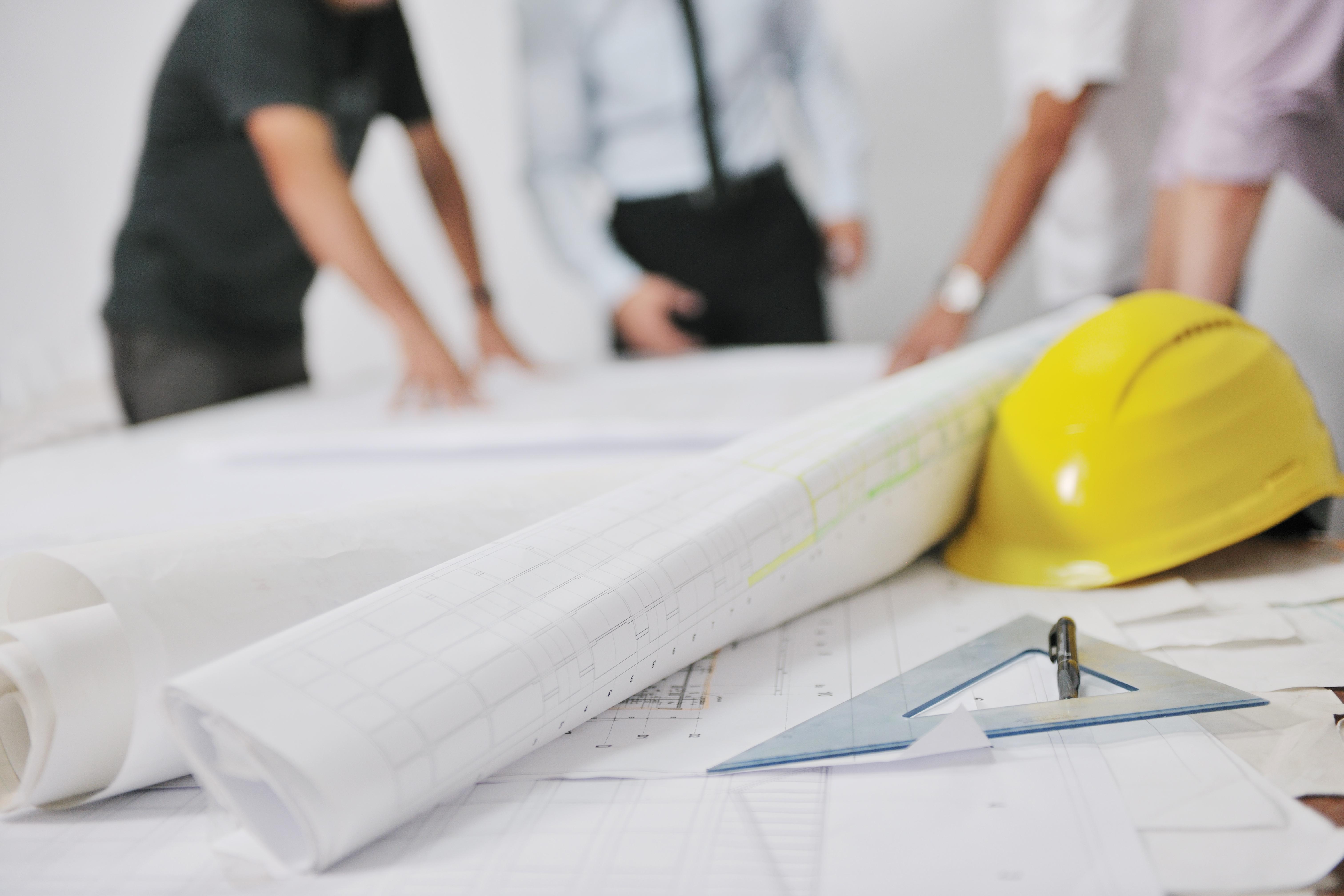 Team of architects on construction site affordable housing
