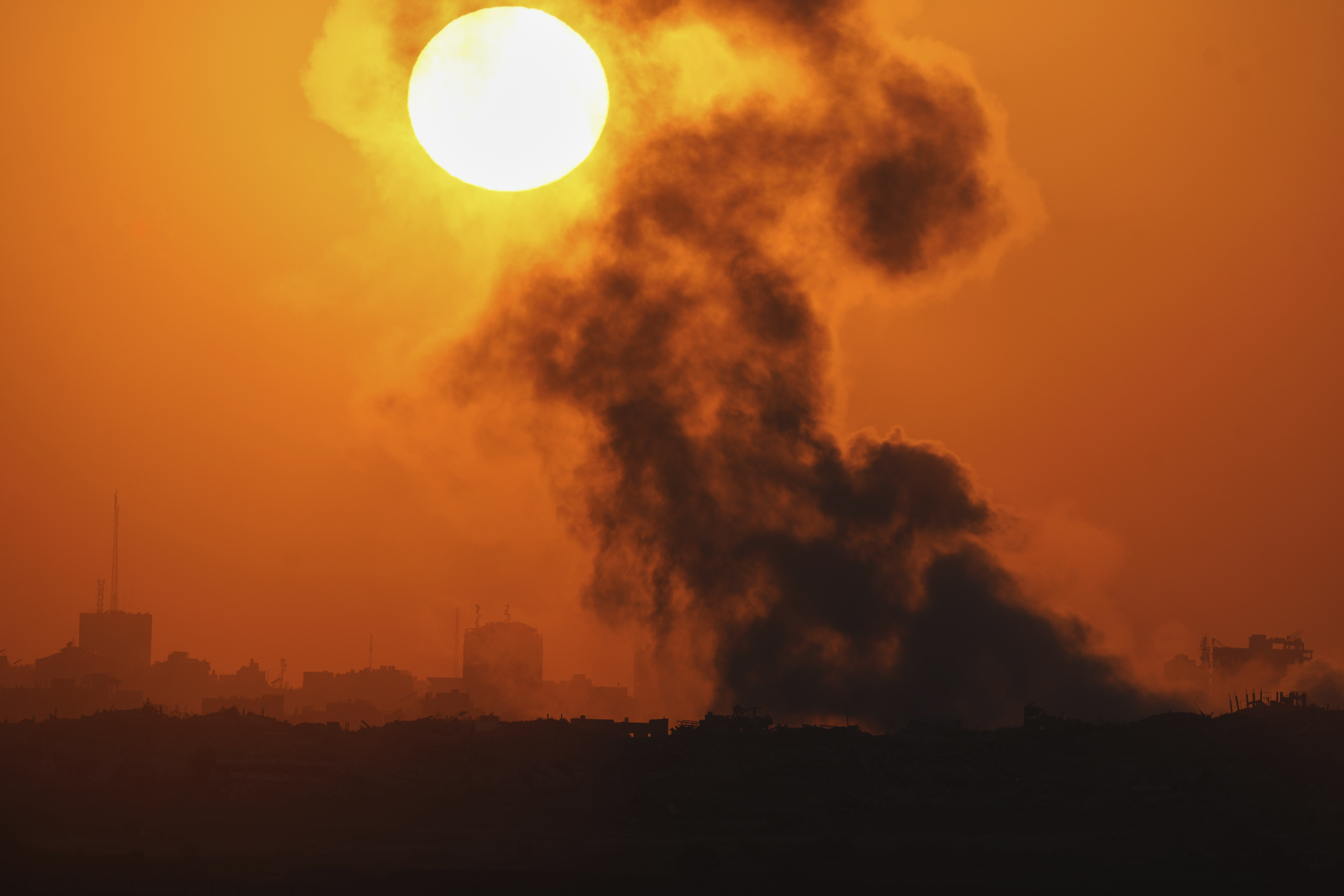 Smoke billows from an explosion in the northern Gaza Strip, as seen from southern Israel Wednesday, July 23, 2025.