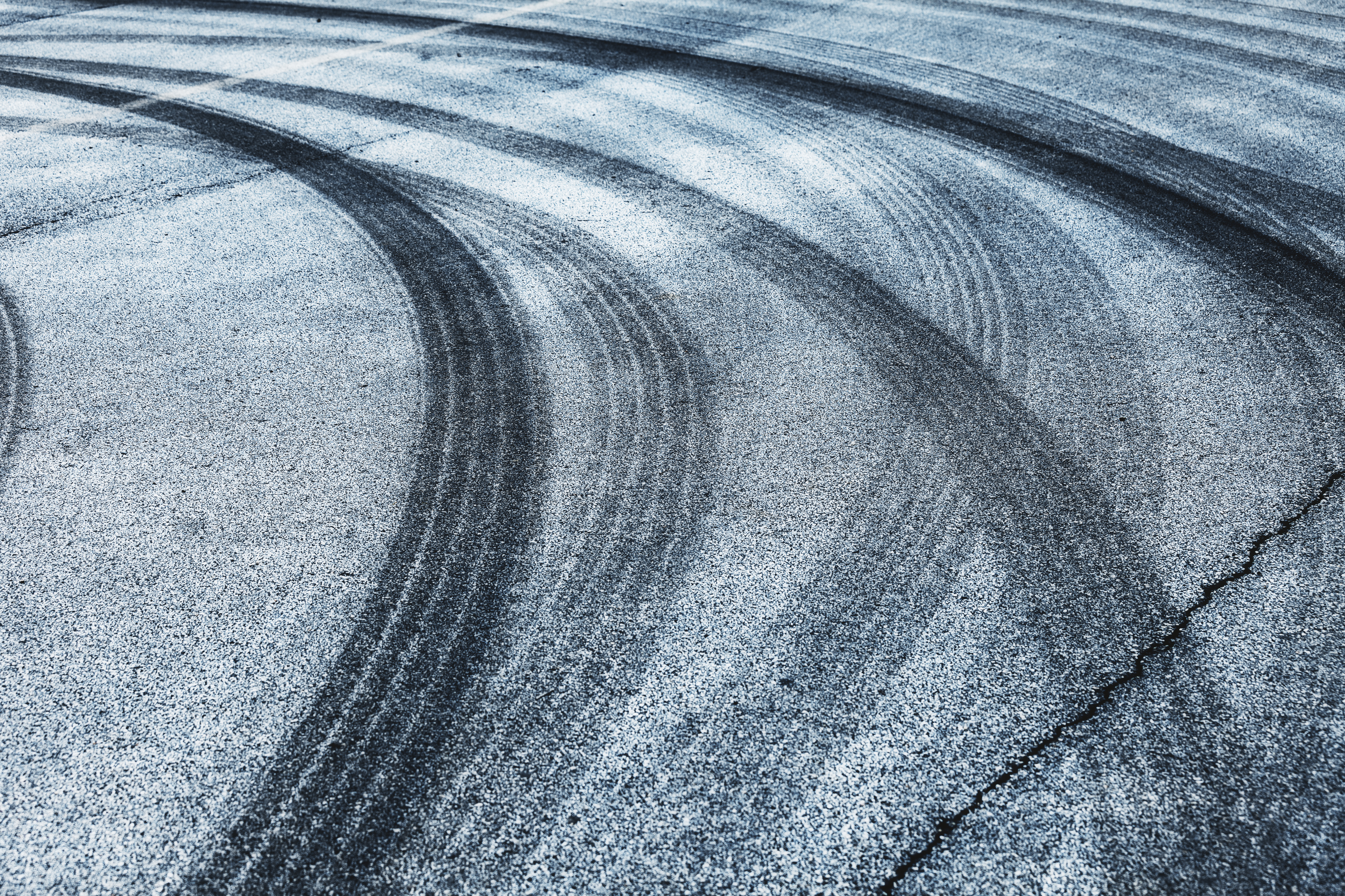 Tire tracks on the asphalt road