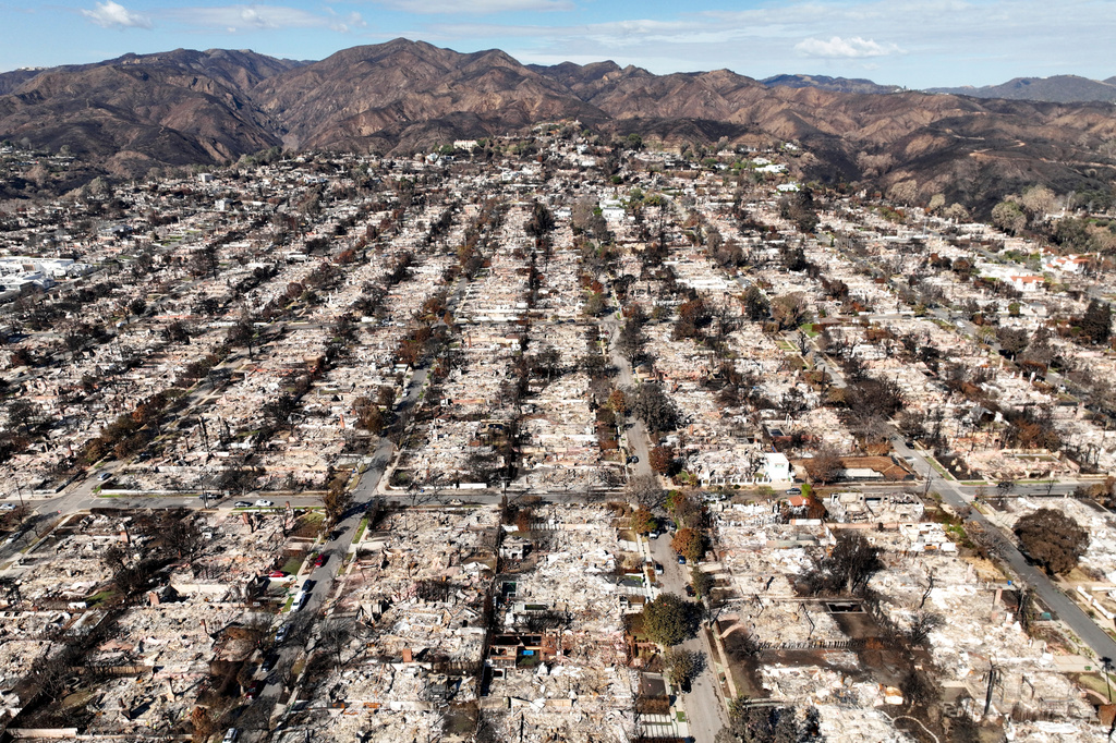 FILE - The devastation from the Palisades Fire is shown in an aerial view of the Pacific Palisades neighborhood of Los Angeles, Monday, Jan. 27, 2025. 
