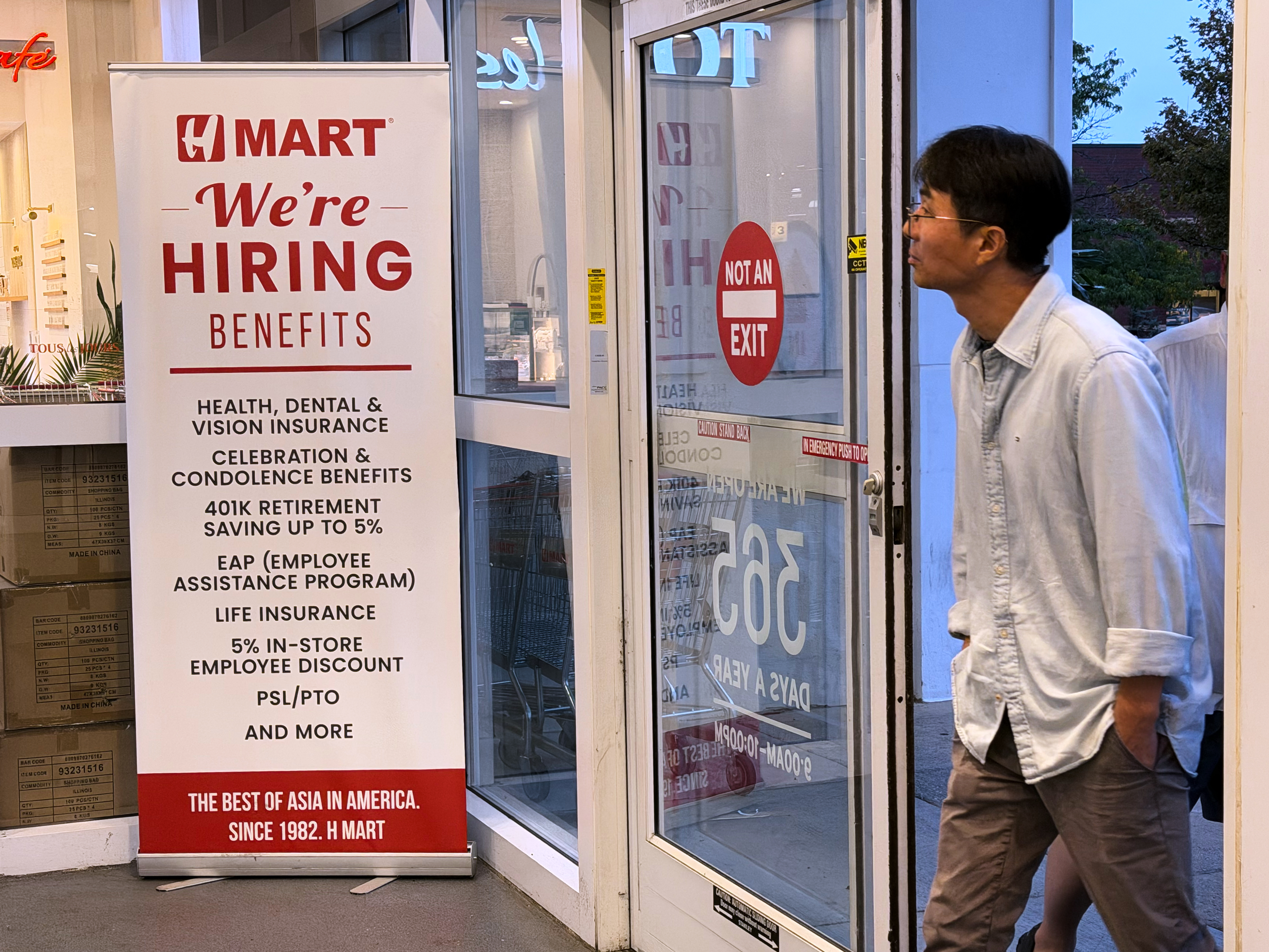 A hiring sign is displayed at a grocery store, in Schaumburg, Ill., Wednesday, Sept. 16, 2026.