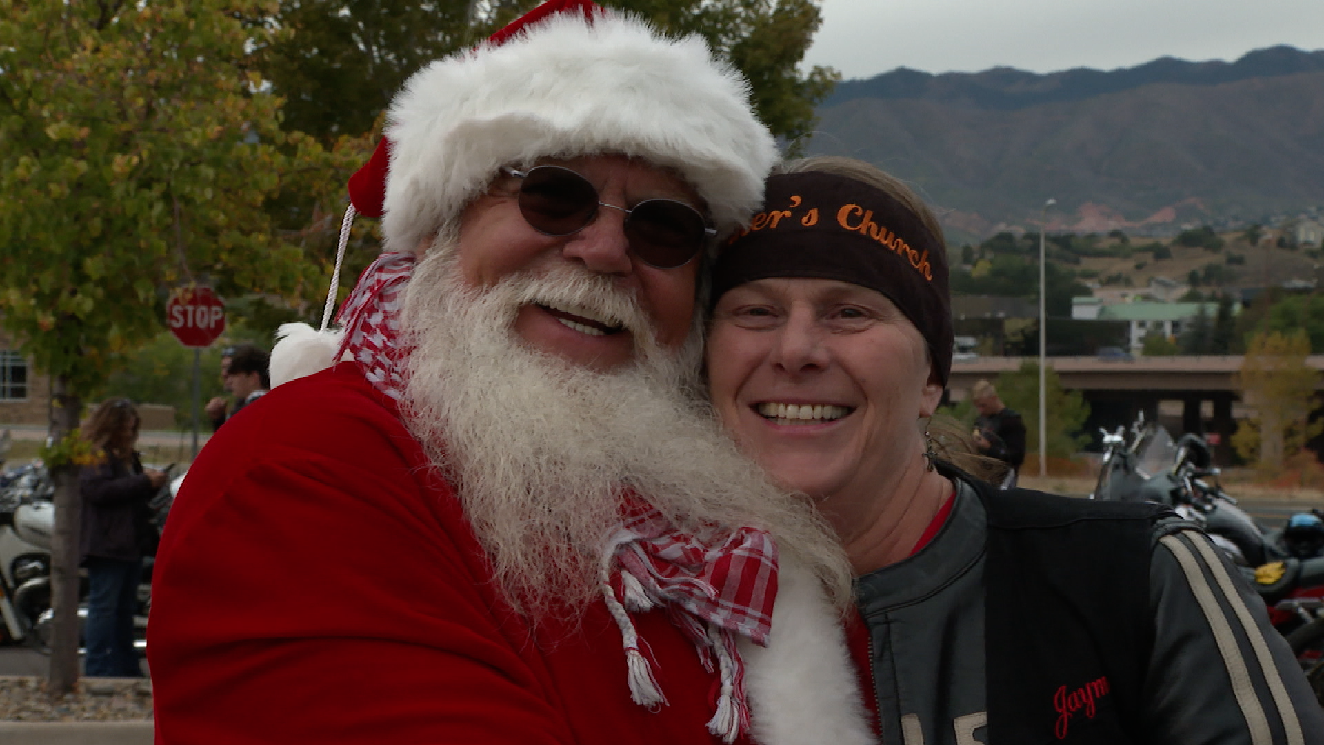 Pastor Jayme Pezoldt poses for a picture with San