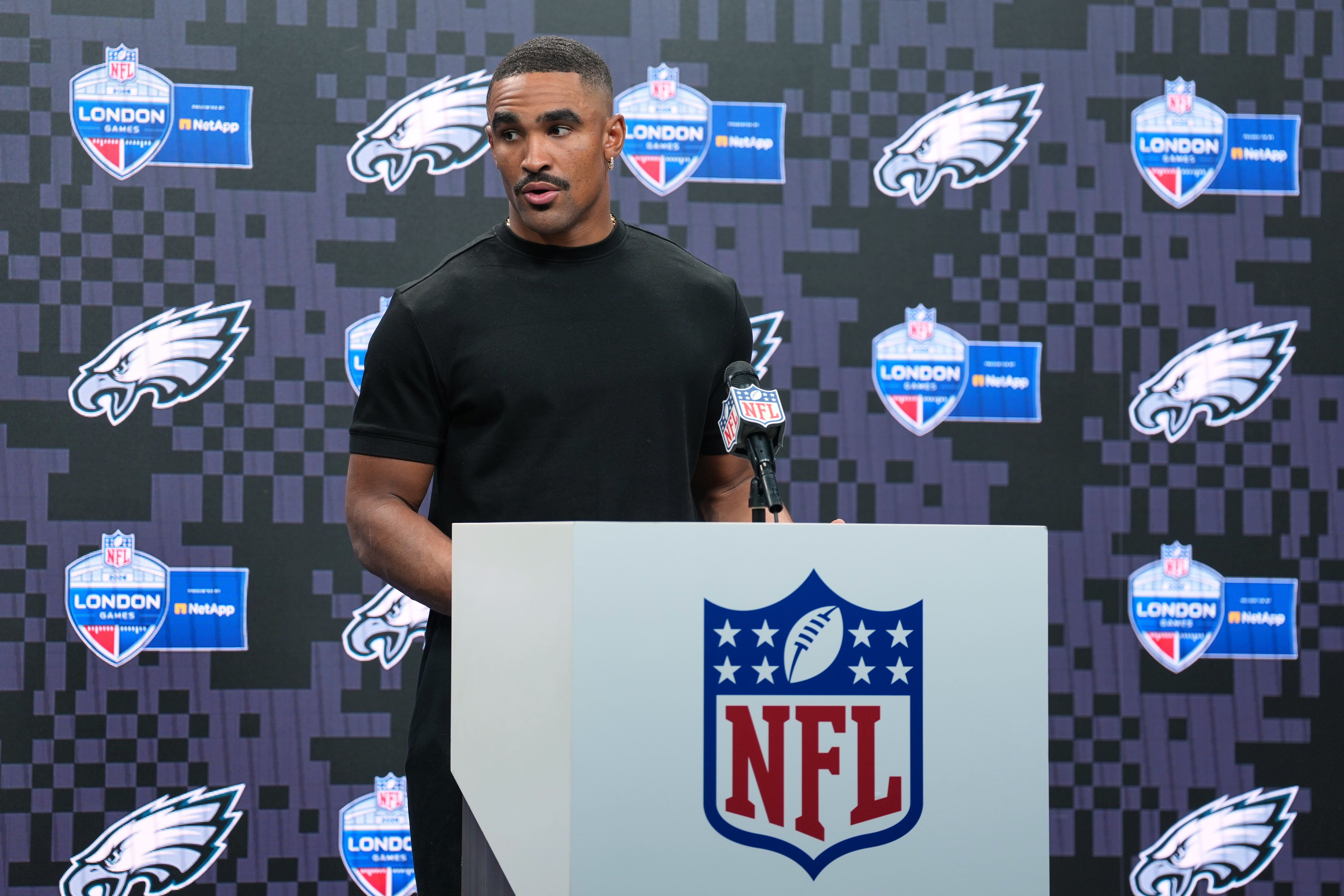 Philadelphia Eagles quarterback Jalen Hurts (1) attends a press conference after an NFL football game against Jacksonville Jaguars in London, Sunday, Oct. 11, 2026. 