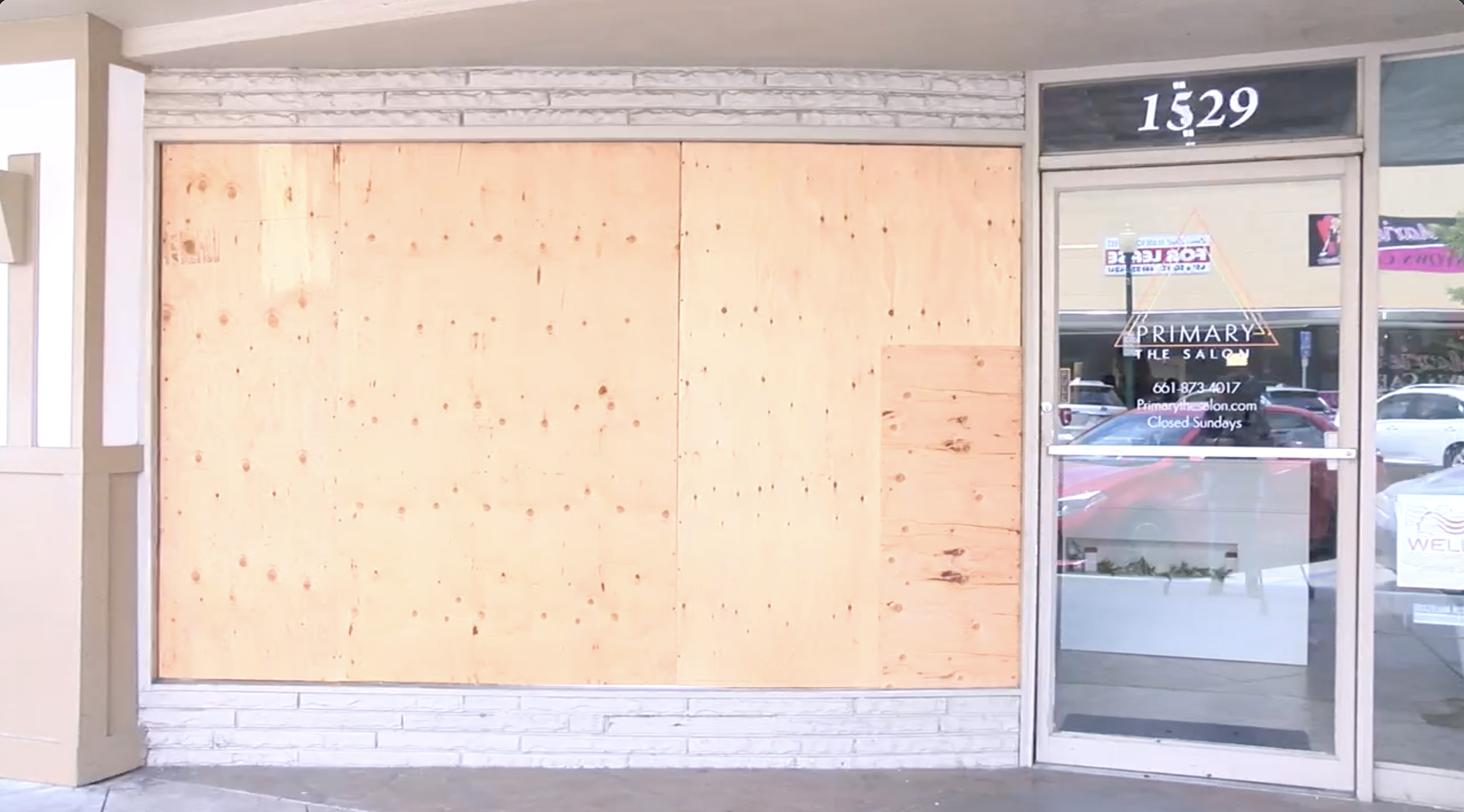 primary the salon boarded window
