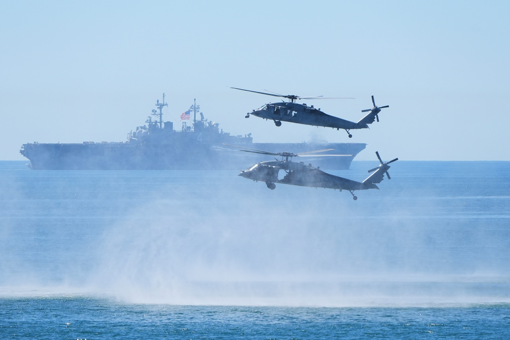 Marines perform a demonstration with helicopters and the amphibious assault ship USS Boxer as Vice President JD Vance, not pictured, watches to mark the upcoming Marine Corps' 250th anniversary Saturday, Oct 18, 2025, on Marine Corps Base Camp Pendleton in Camp Pendleton, Calif. 