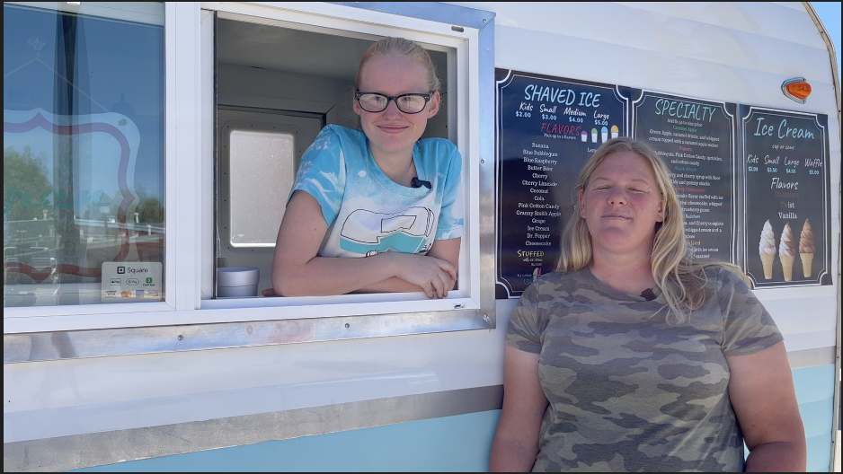 Crystal and Kaylie Bender sell soft-serve ice cream and snow cones from their vintage-style trailer