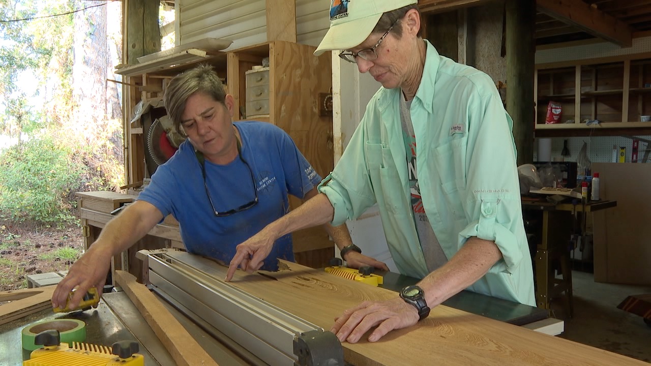 Volunteers at Big Bend Maritime Center working with wood