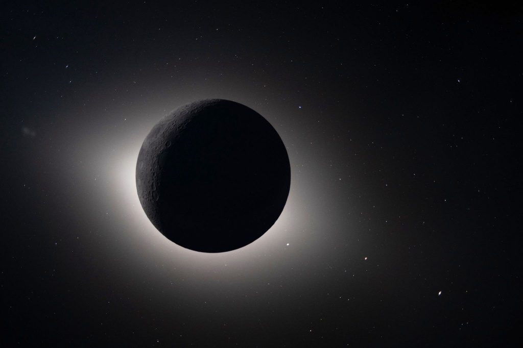 FILE - In this photo provided by NASA and captured by the Artemis II crew from lunar orbit, the moon eclipses the sun on April 6, 2026.