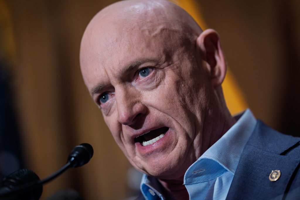 Sen. Mark Kelly, D-Ariz., refutes efforts by President Donald Trump and Defense Secretary Pete Hegseth to intimidate him and other lawmakers after expressing concerns over U.S. military strikes against vessels suspected of smuggling drugs in the Caribbean, during a news conference at the Capitol, in Washington, Monday, Dec. 1, 2025.