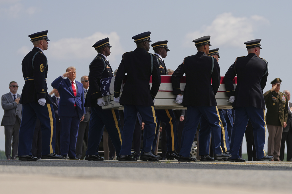 President Donald Trump salutes as a U.S. Army carry team moves a transfer case containing the remains of Pvt. Isabella Gonzales of Carrollton, Texas, Wednesday, July 22, 2026, at Dover Air Force Base, Del. 