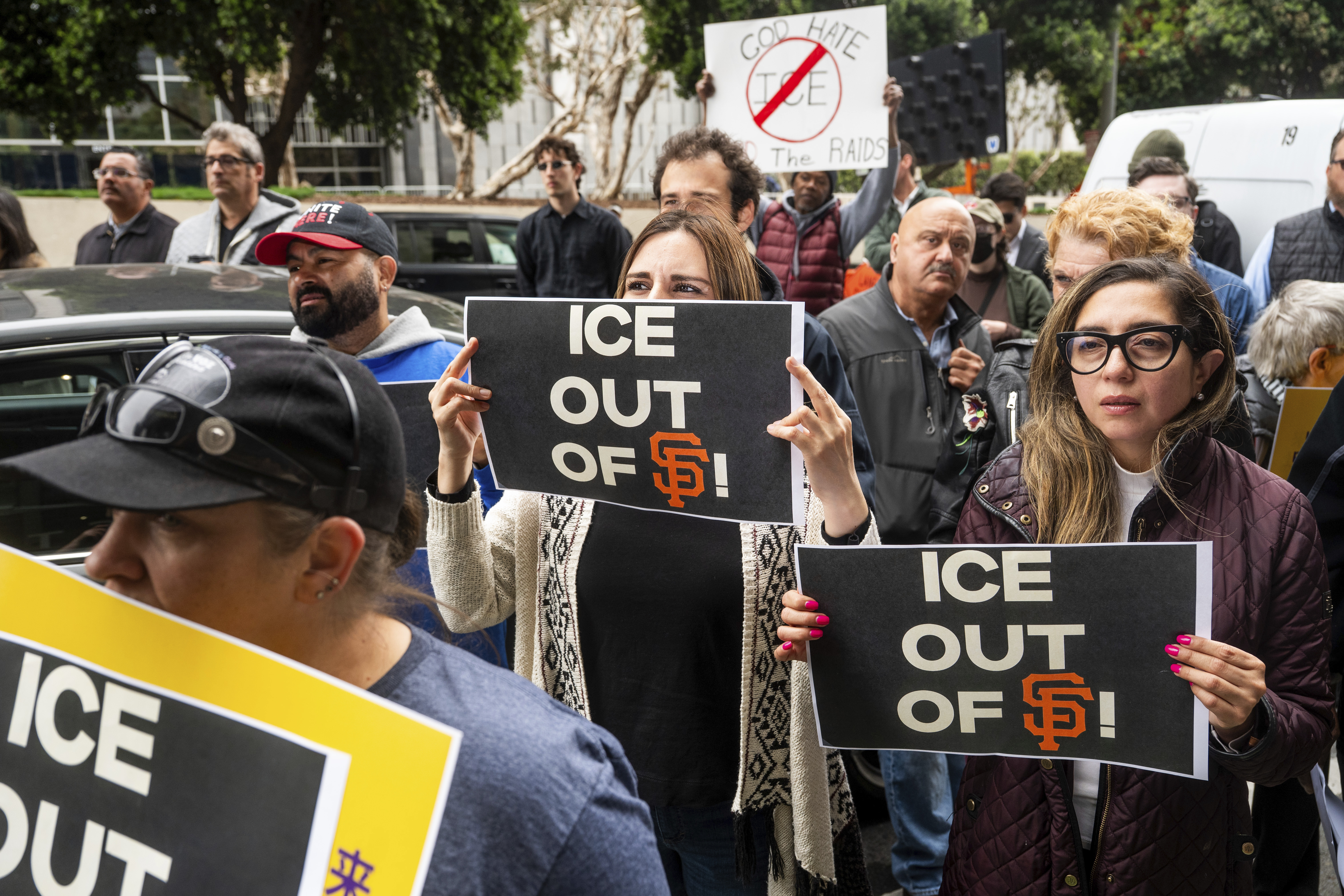 Maria Sanabria, center, holds a sign while rallying for David Huerta, the president of Service Employees International Union California, who was arrested during a Los Angeles protest, on Monday, June 9, 2025, in San Francisco. 