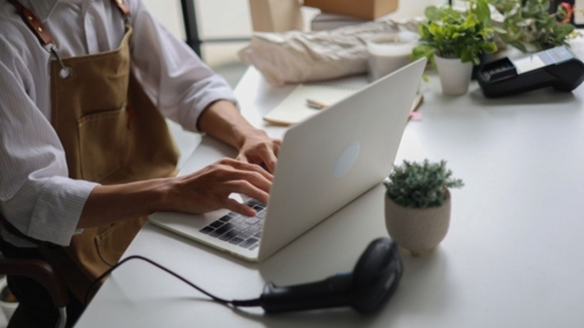 Stock image of a small business owner working on a laptop.