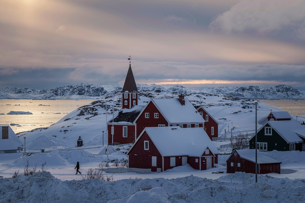  A woman walks near a church in Nuuk, Greenland, on March 7, 2025. 