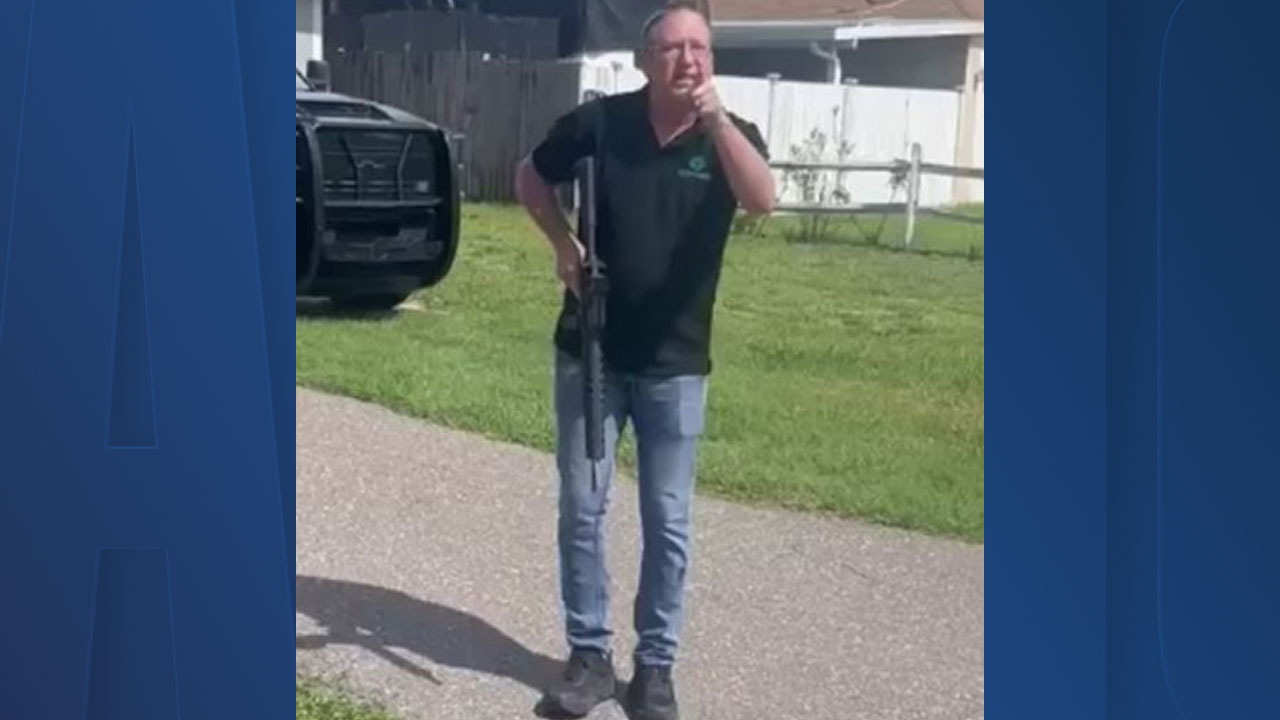 David H. Berry, 44, allegedly pointed assault rifle at landscaper