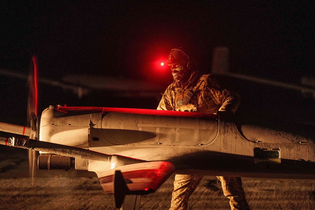 A Ukrainian serviceman of the 14th Separate Unmanned Aerial Systems Regiment prepares a long-range drone An-196 Liutyi before takeoff in undisclosed location, Ukraine.