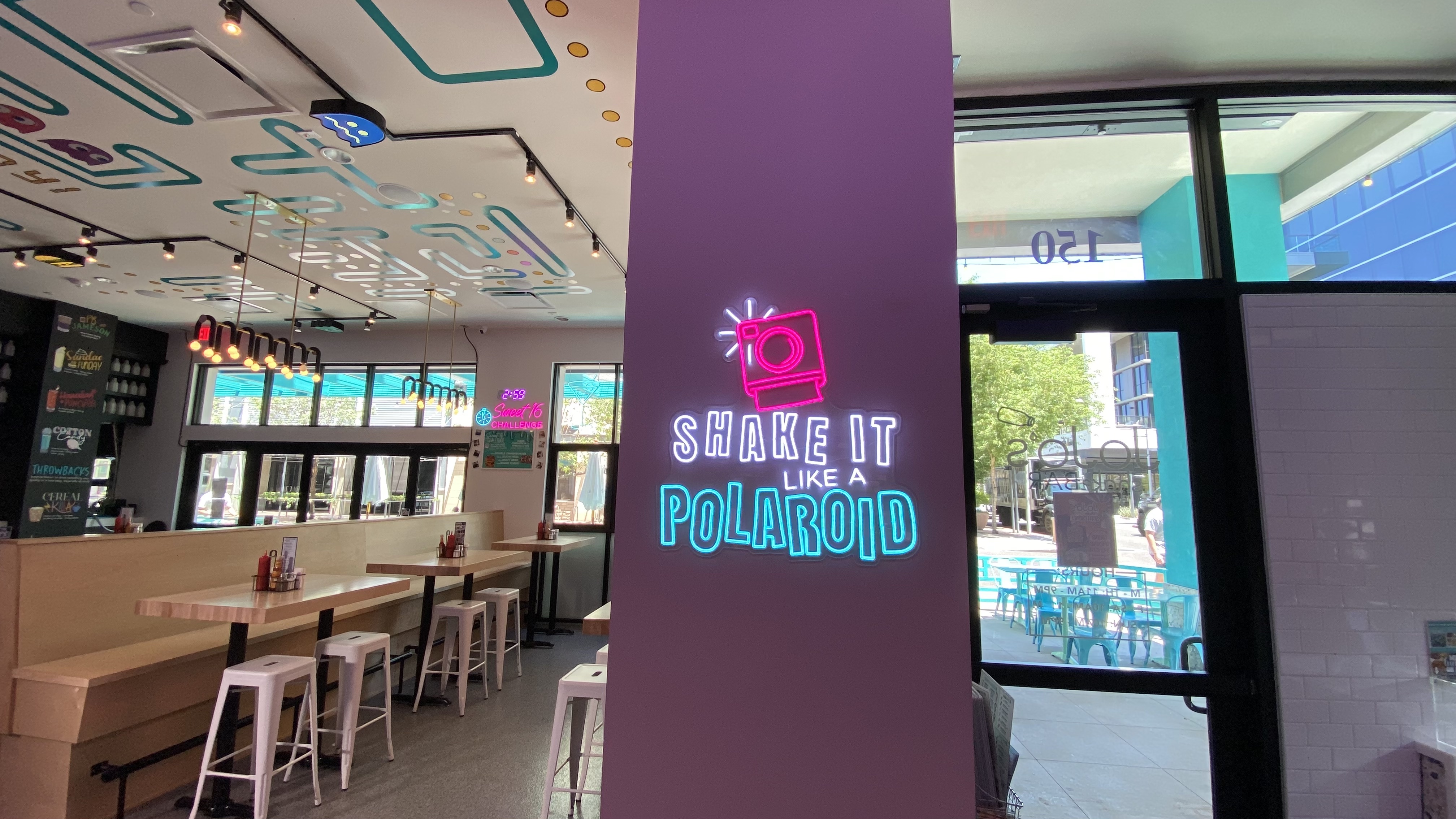 Vibrant colors and neon lights give the 80s, 90s restaurant and bar a modern twist. 