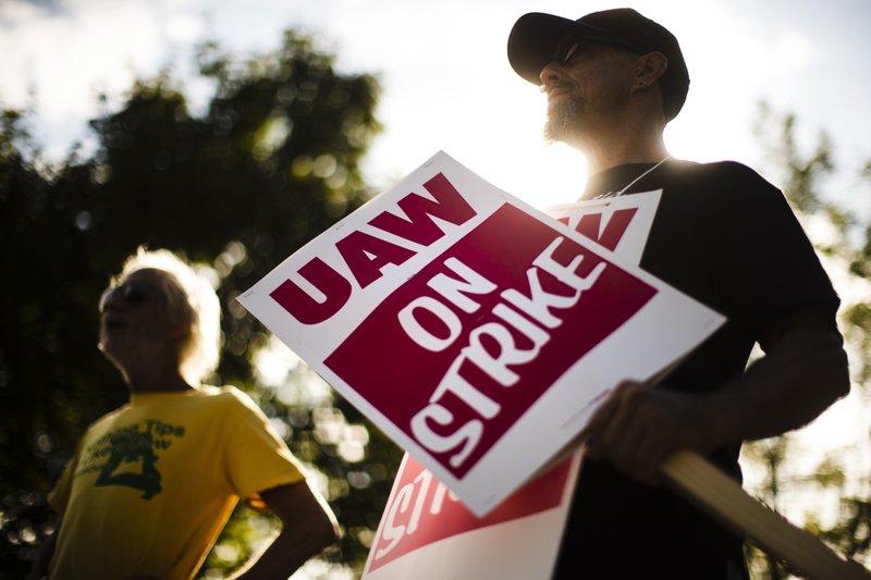 FILE - In this Sept. 16, 2019 file photo, union members picket outside a General Motors facility in Langhorne, Pa. The strike against GM by United Auto Workers entered its second week Monday, Sept. 23 with progress reported in negotiations but no clear end in sight. Bargainers met all weekend and returned to talks Monday morning as the strike entered its eighth day. (AP Photo/Matt Rourke, File)