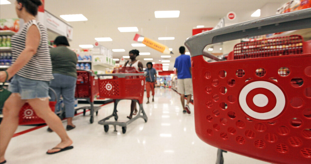 FILE- In this Thursday, July 5, 2012, file photo, customers fill the aisles at a Target store in Chicago. Discount retailer Target Corp. said Thursday, Aug. 2, 2012 that a key revenue measure rose more than expected in July, as more shoppers visited its stores and spent more on their purchases. 