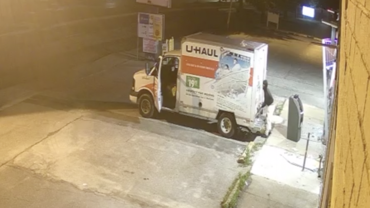 Screenshot from surveillance video of ATM being stolen from Quick Mart in Towson