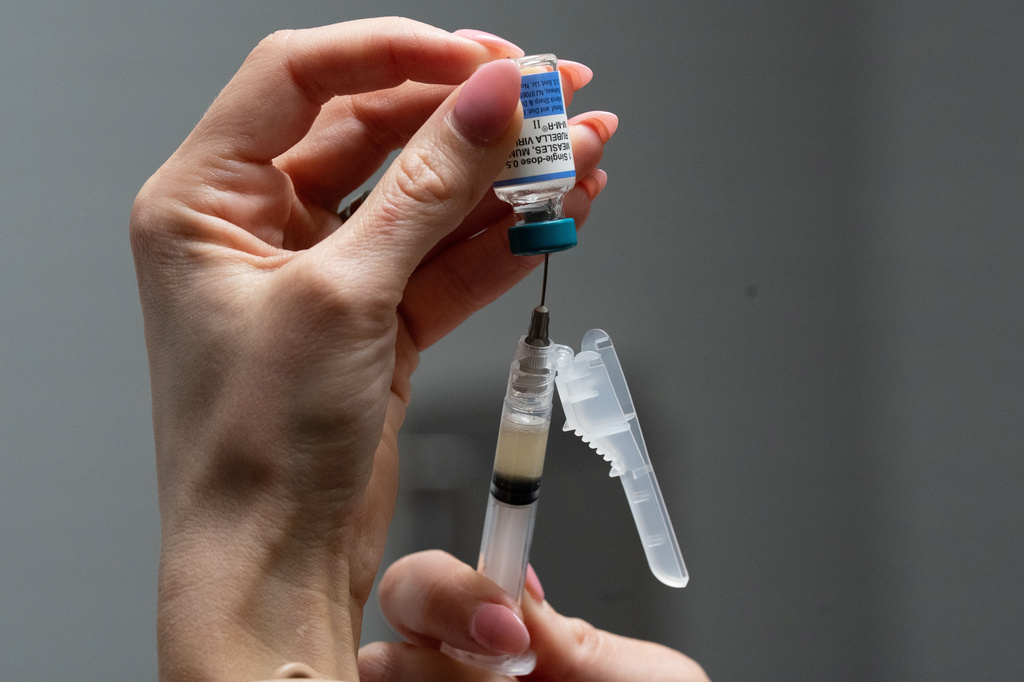  Lauren Ellenburg, a nurse, prepares a combination measles, mumps and rubella vaccine for a patient at Tiger Pediatrics in Easley, S.C., March 17, 2026. 