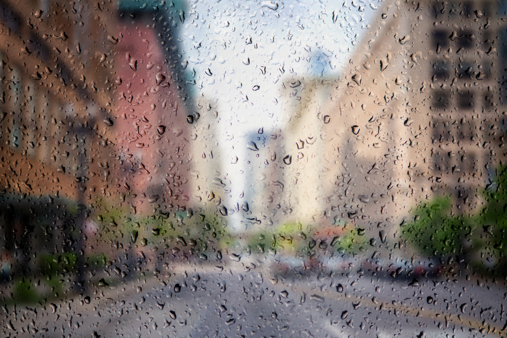 Chicago downtown through the window of cafe with rain drops.