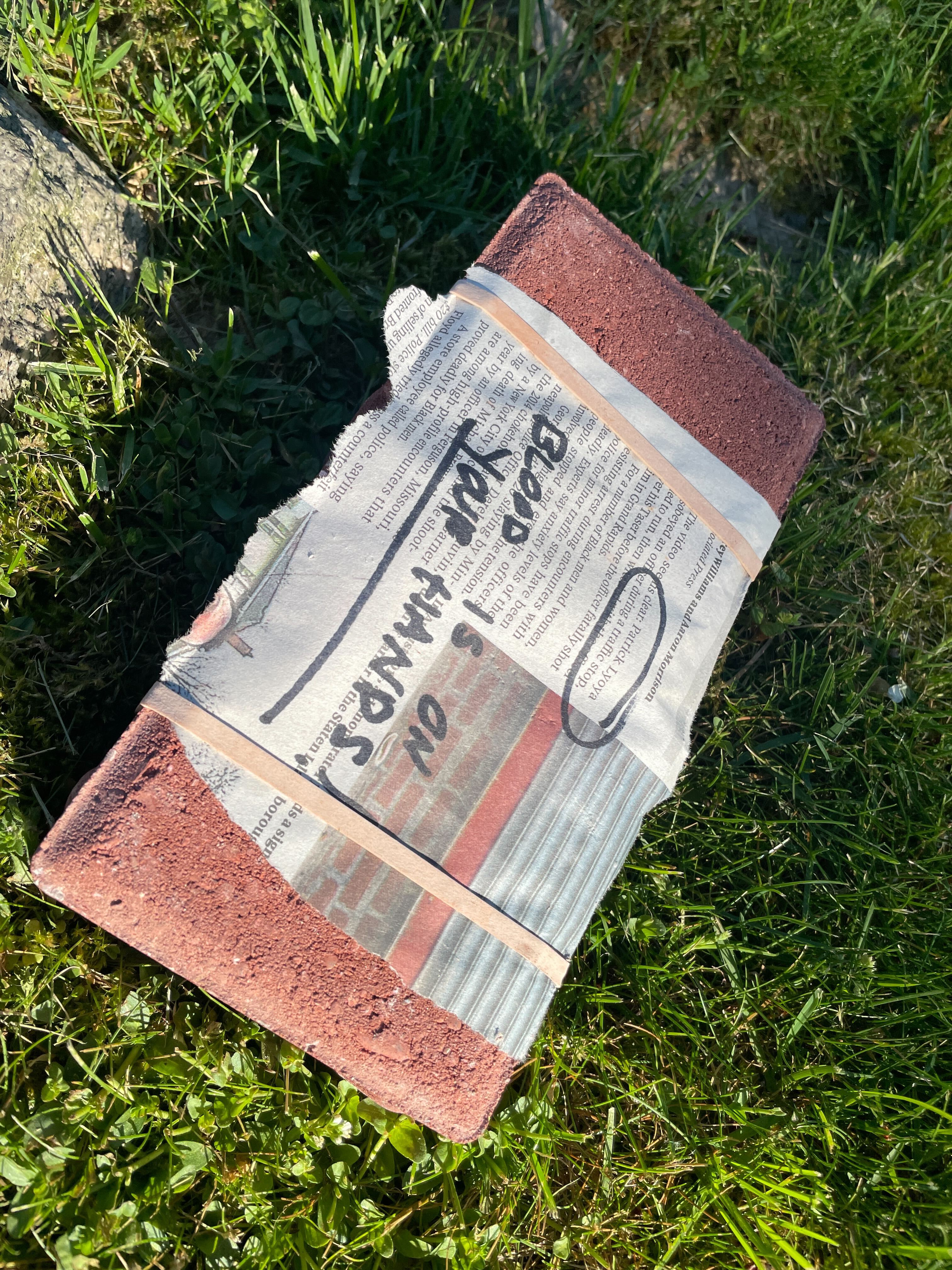 A brick left on the lawn of Commissioner Jon O'Connor
