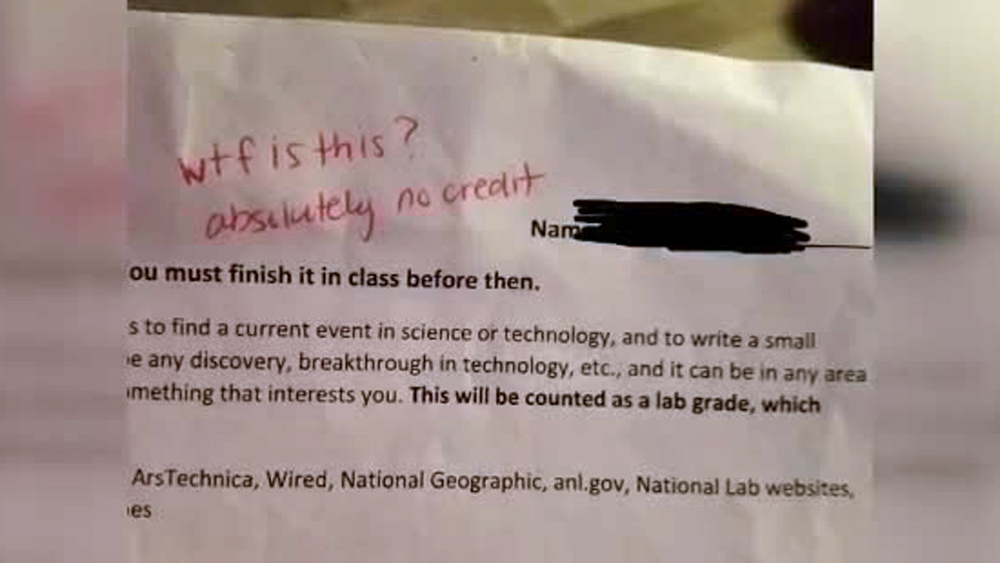 wptv-wtf-teacher-writes-on-student-paper.jpg