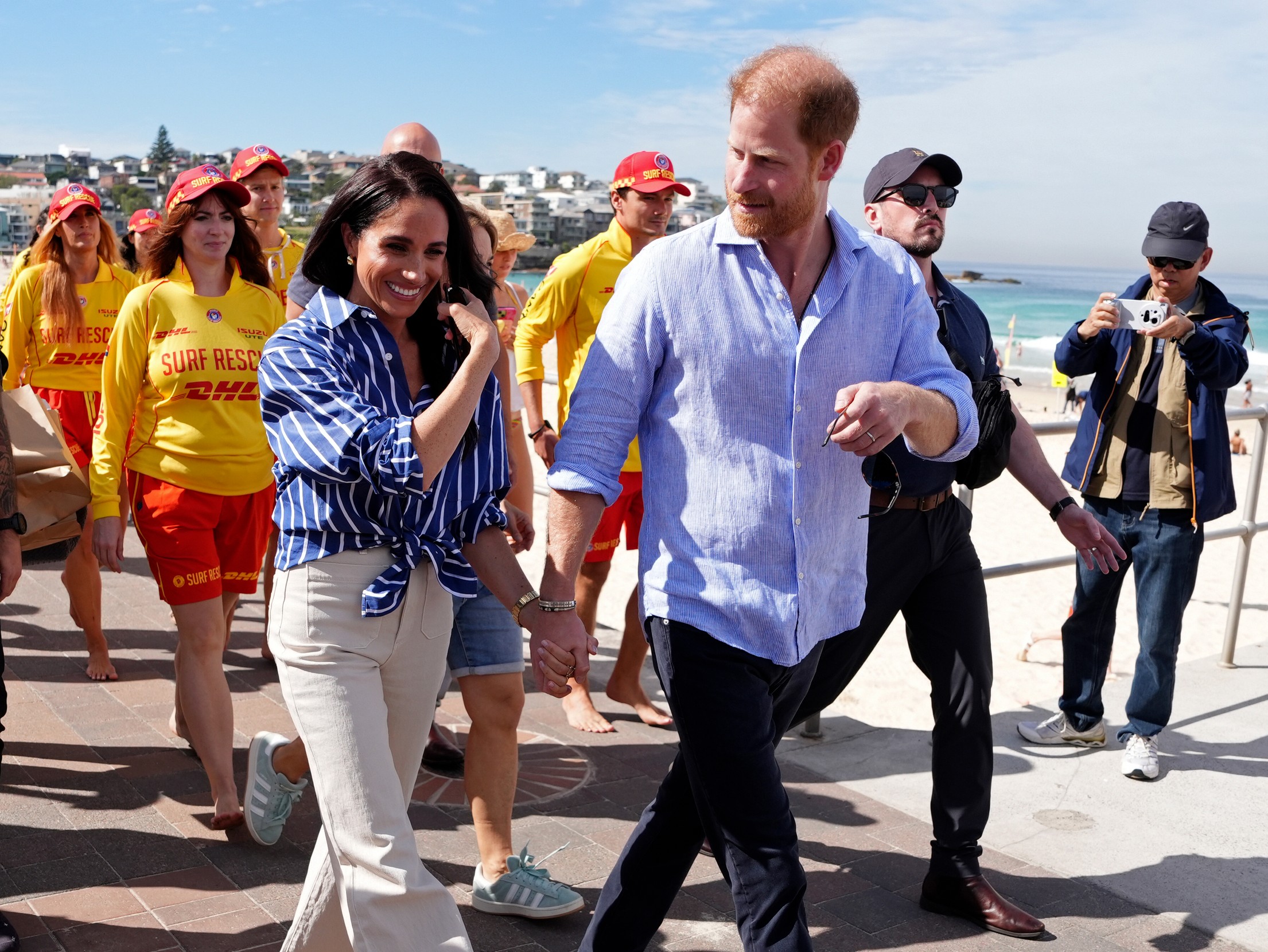 FILE - Prince Harry, and Meghan, the Duke and Duchess of Sussex, walk along the boardwalk after meeting volunteer first responders from Bondi Surf Bathers' Life Saving Club, during a visit to Bondi Beach, Australia, Friday, April 17, 2026.