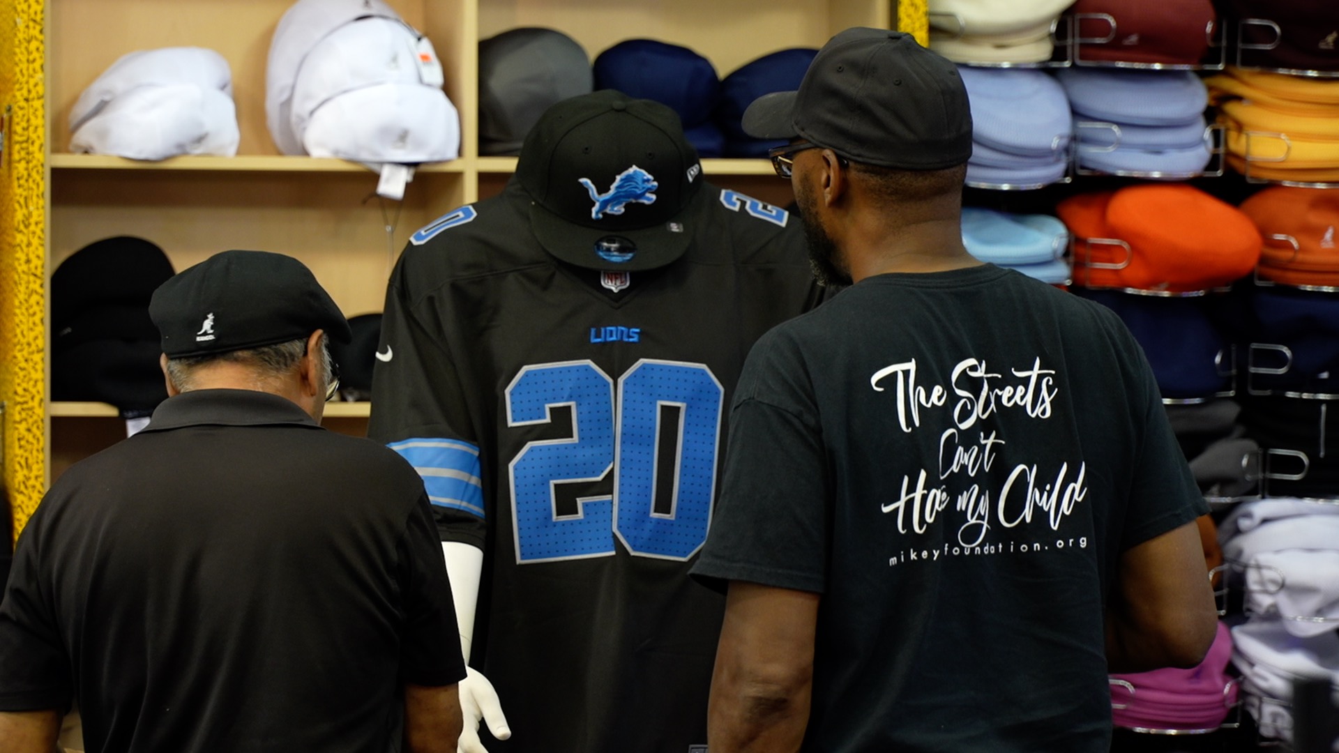 Lions fans in front of jersey