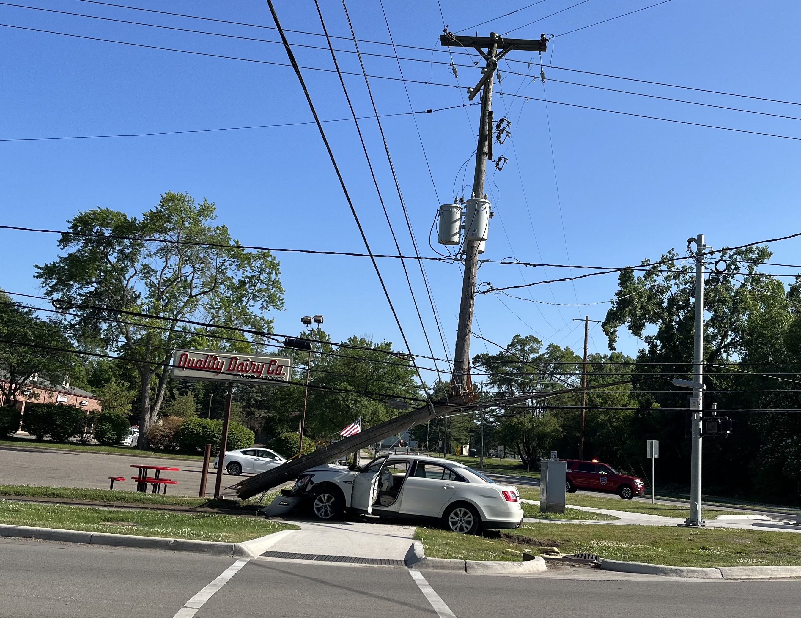 Car hits power pole in East Lansing.jpg