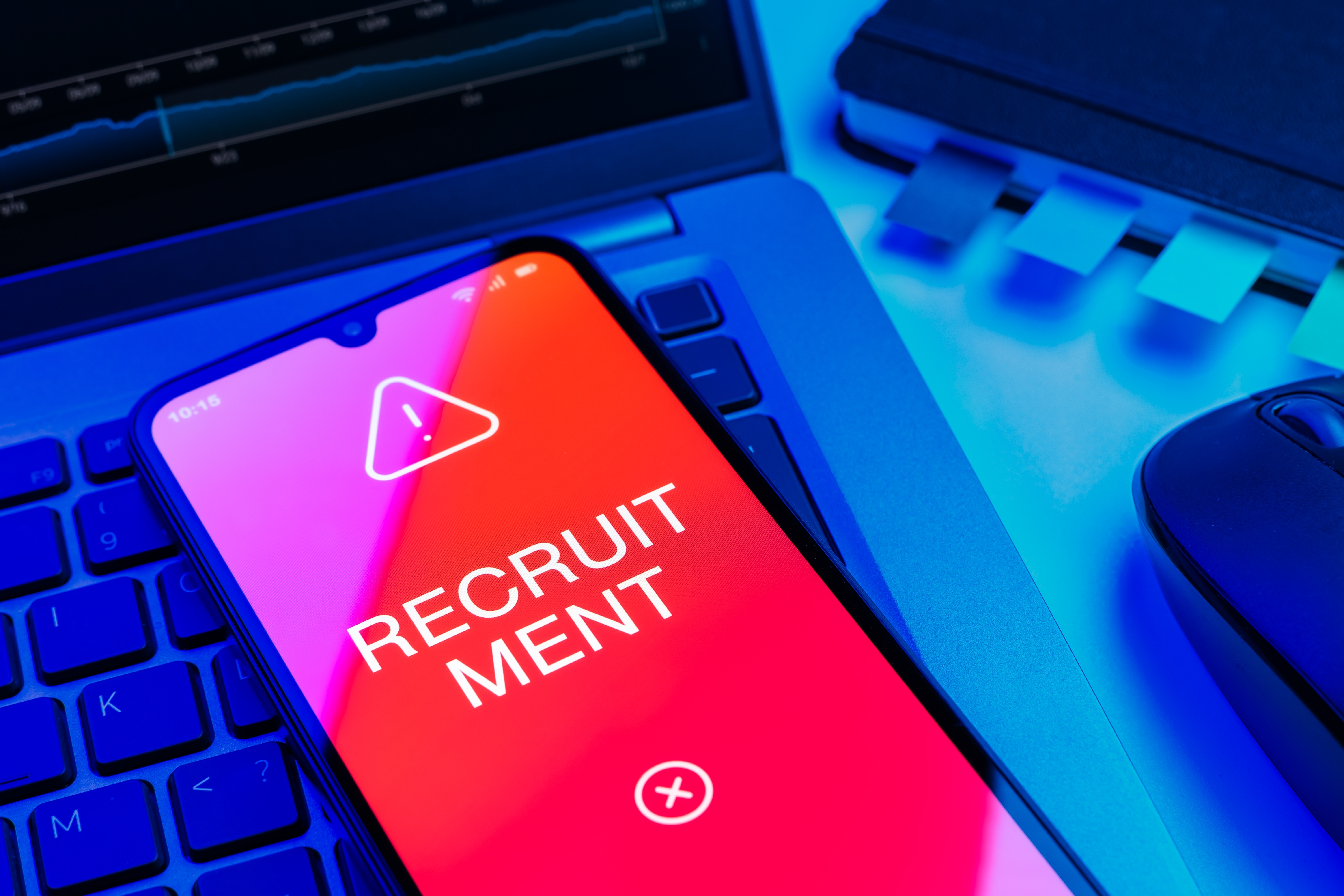 A laptop with a phone