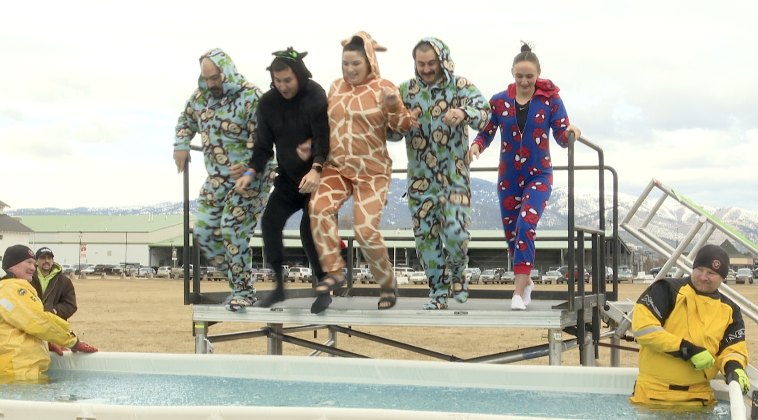 Missoula PD jumping into an ice-cold pool, Missoula