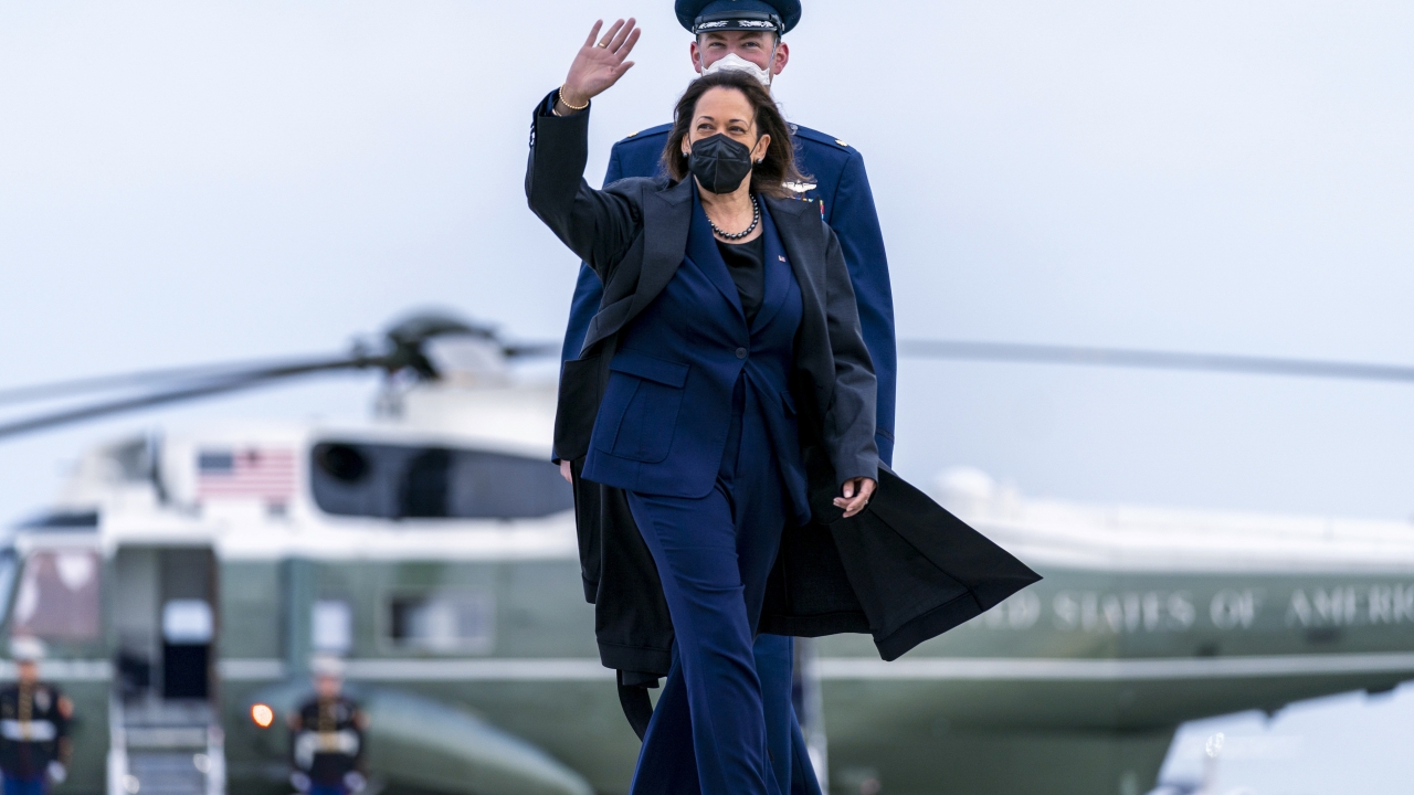 Vice President Kamala Harris walks across the tarmac to board her plane at Andrews Air Force Base.