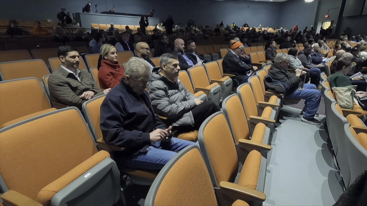 Audience members listen during a public meeting about regional traffic and transportation issues and the Browns stadium project in Brook Park.