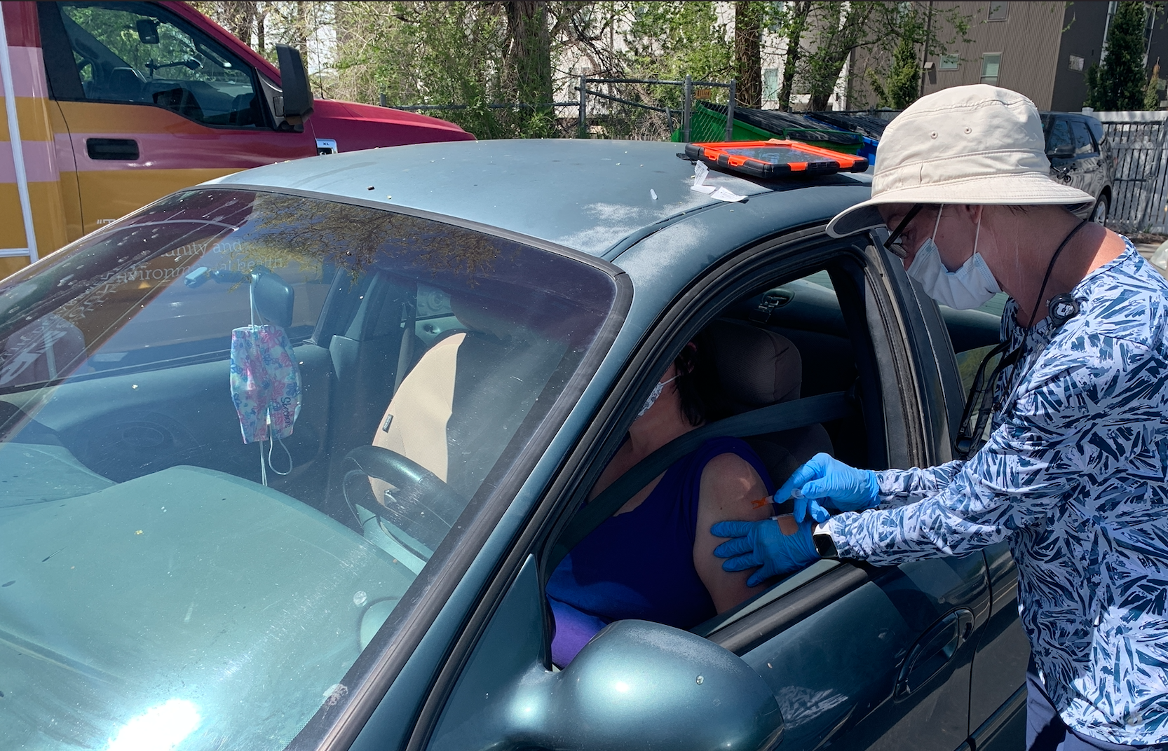 Woman gets vaccine at Maliheh Clinic