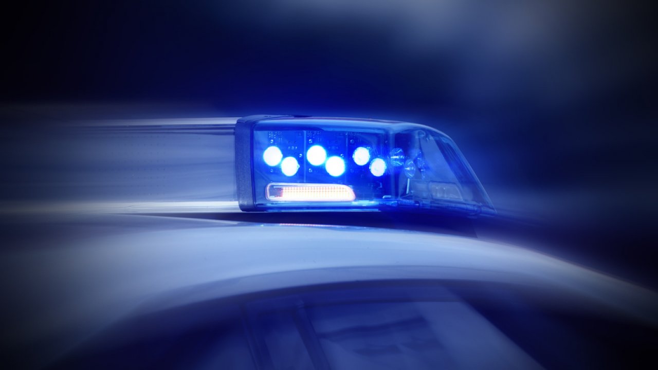 A police vehicle with blue lights.