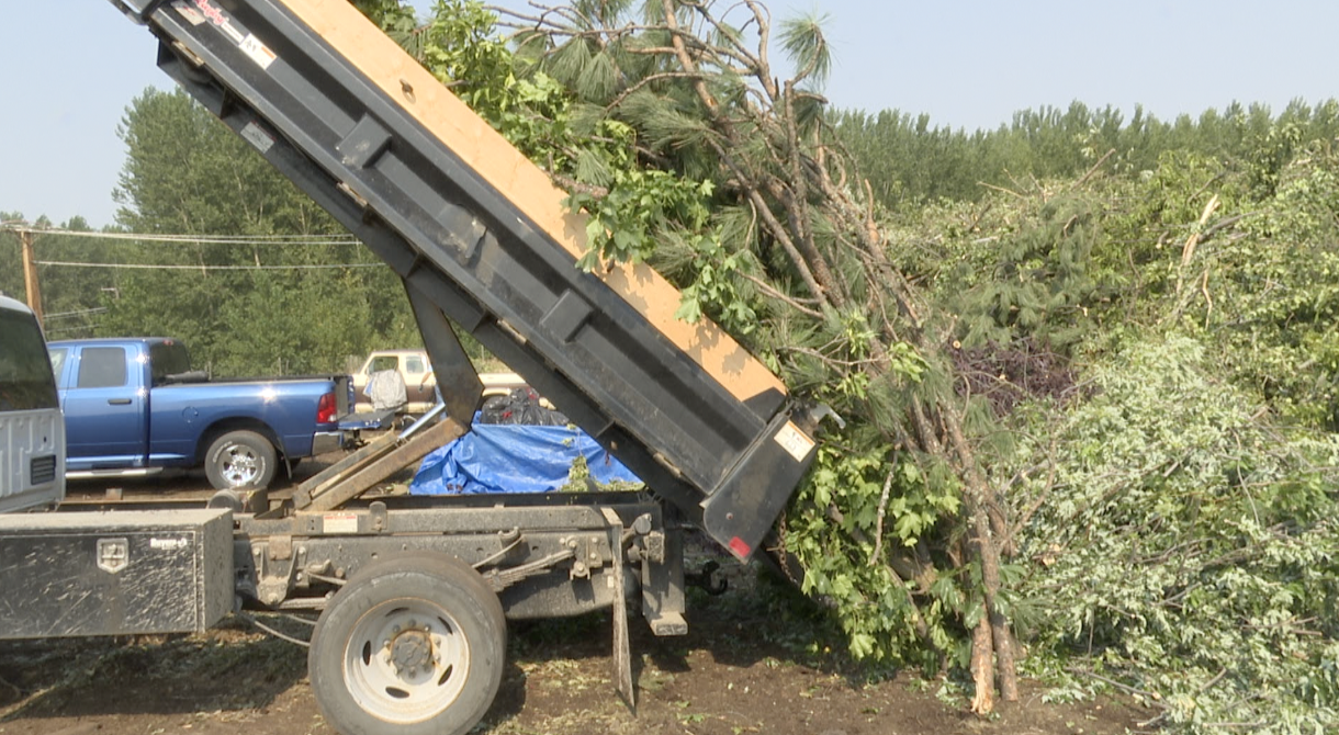 Dump truck unloads into a pile at Garden City Compost, Missoula