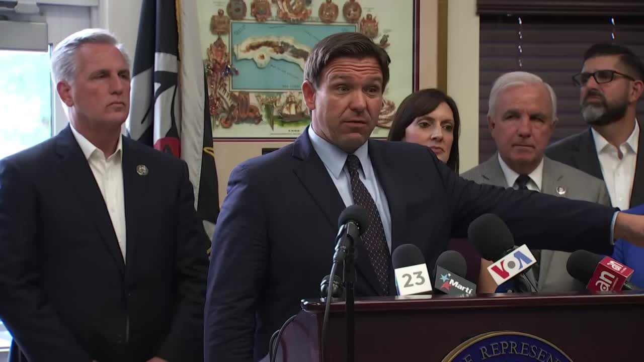 Gov. Ron DeSantis speaks as Rep. Kevin McCarthy listens during news conference in Hialeah Gardens, Aug. 5, 2021
