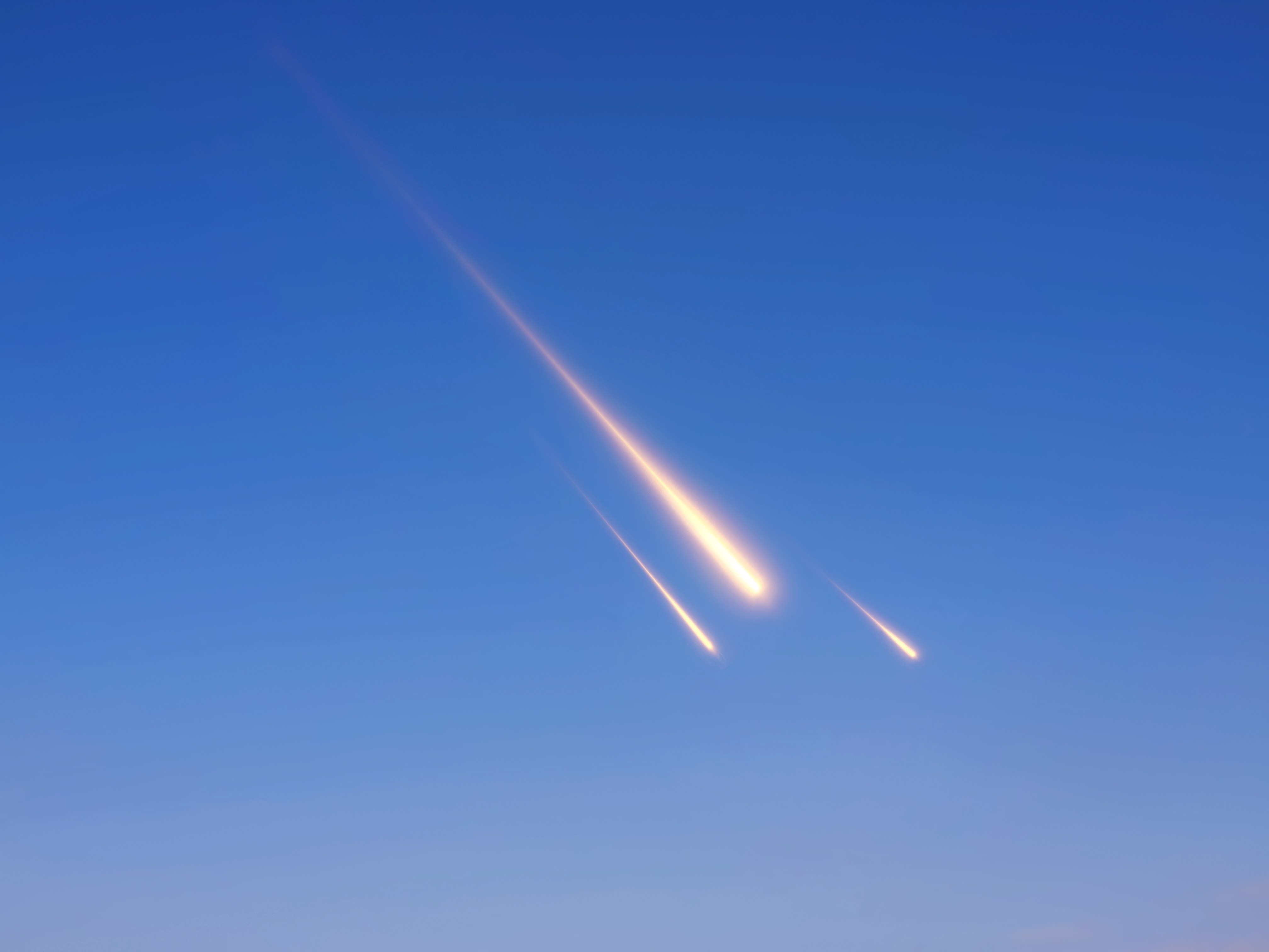 A meteor breaks apart in the Earth's atmosphere.