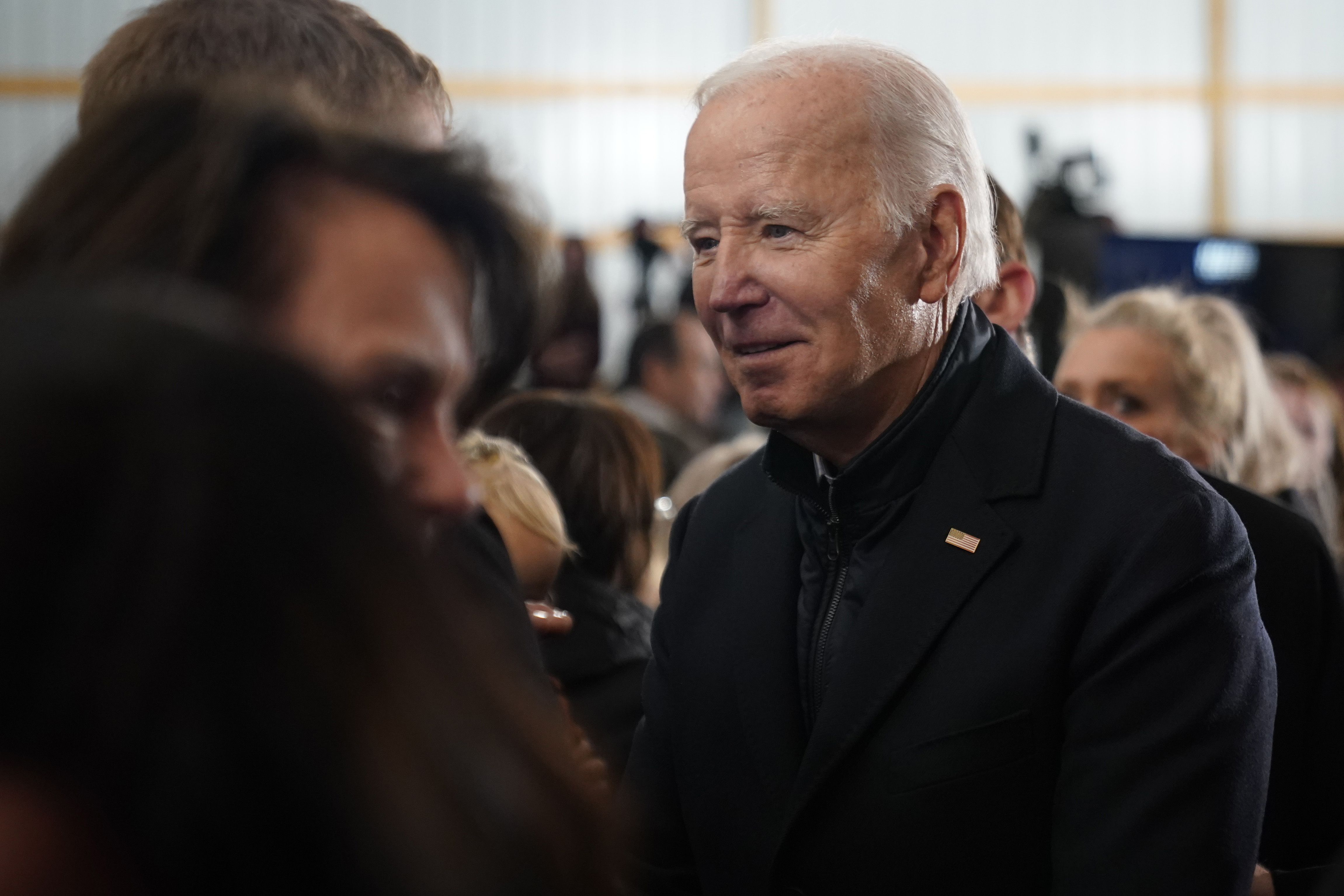 President Joe Biden talks with guests after speaking at Dutch Creek Farms in Northfield, Minn., Wednesday, Nov. 1, 2023. (AP Photo/Andrew Harnik)