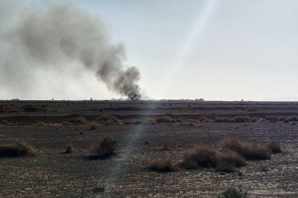 In this image provided by Sepahnews, the Iranian Revolutionary Guard's official website, black smoke rises into the air at what Iran's state TV claimed was the site where an American transport plane and two helicopters involved in a rescue operation were shot down, in Isfahan province, Iran, April, 2026.