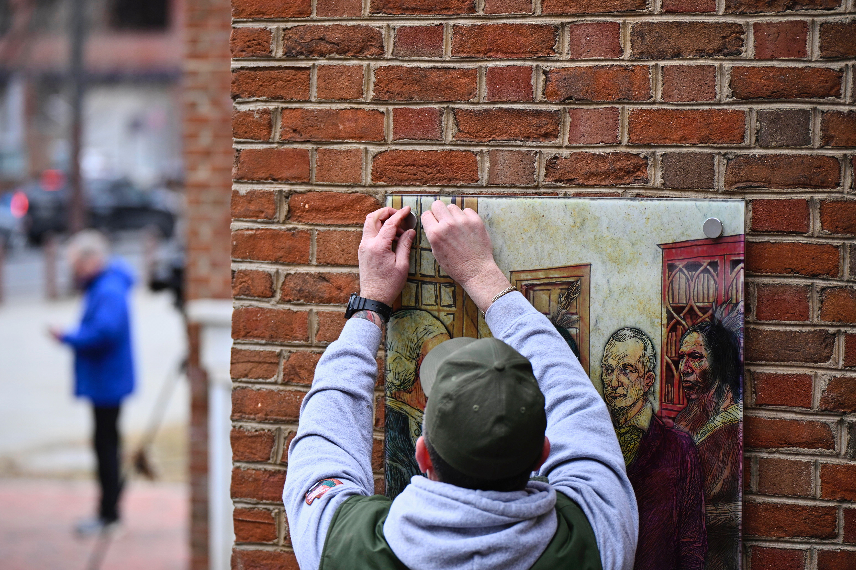 Panels that were part of an exhibit on slavery at the President's House Site in Philadelphia are put back Thursday, Feb. 19, 2026.