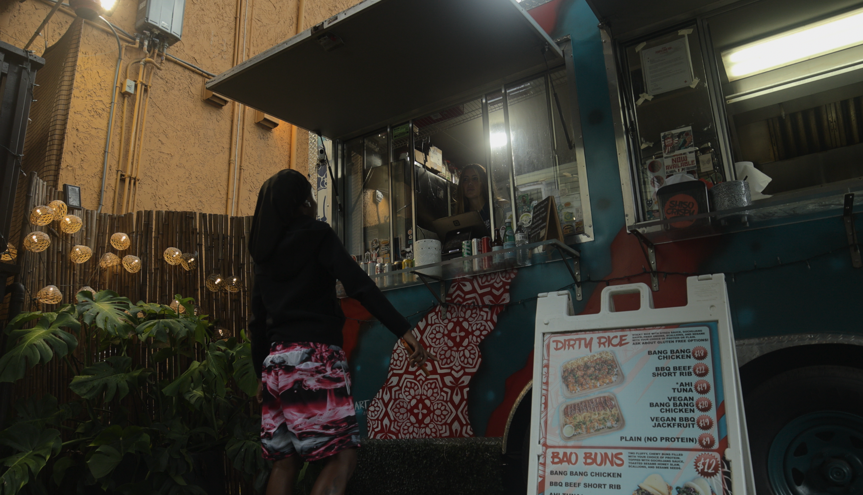 Ronicca Whaley, owner Shiso Crispy food truck, takes a customers order.
