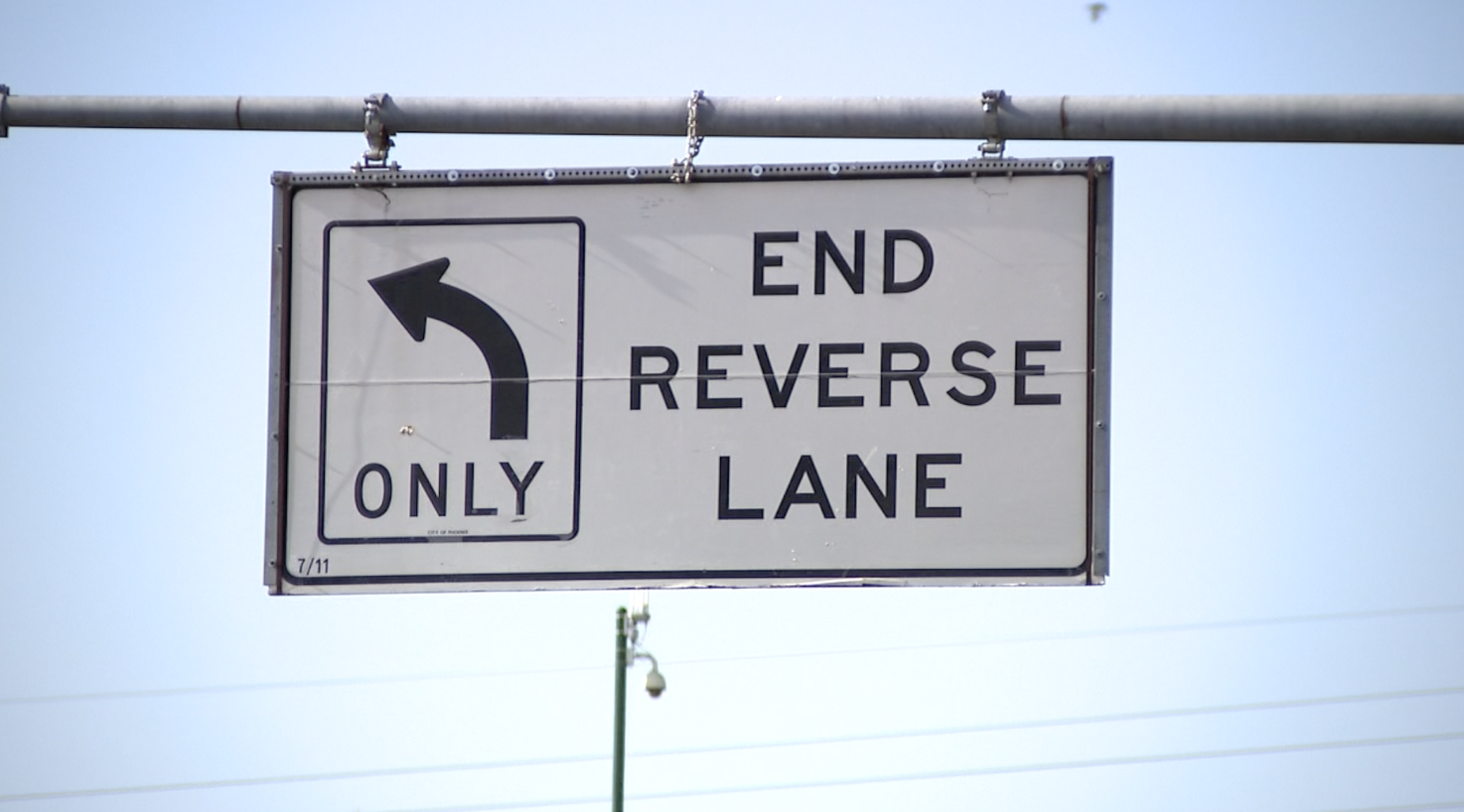 end reverse lane sign 