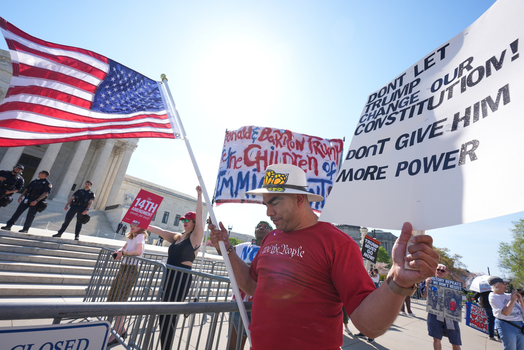 Michael Martinez prays as he joins supporters of birthright citizenship at a rally outside the Supreme Court while the justices hear oral arguments on whether President Donald Trump can deny citizenship to children born to parents who are in the United States illegally or temporarily, on Capitol Hill, in Washington, Wednesday, April 1, 2026.