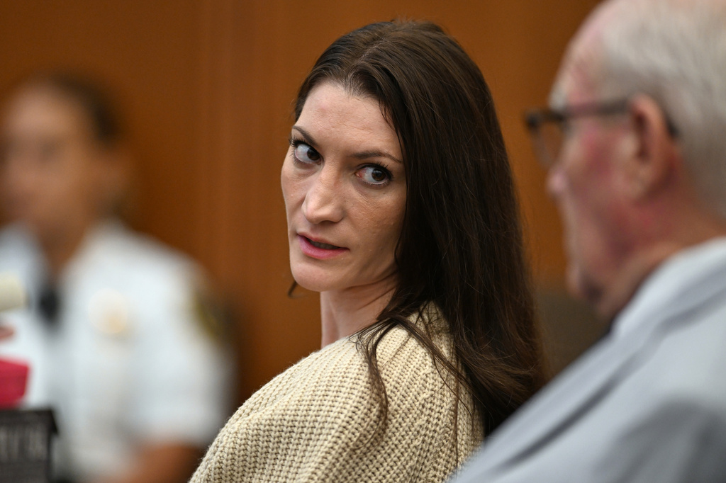 Lindsay Clancy, center, speaks with her lawyer Kevin Reddington during proceedings in her murder trial, Aug. 20, 2026, in Plymouth, Mass. 