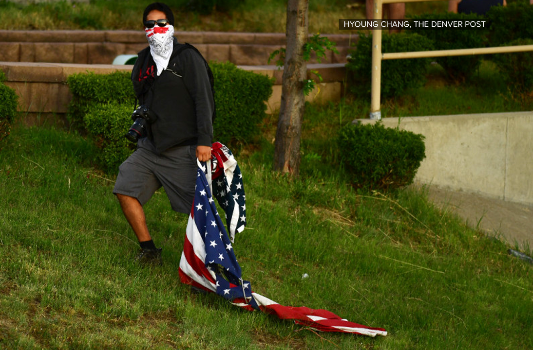 ice-protester-with-flag.png