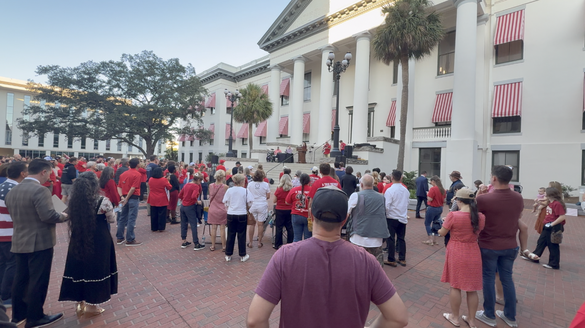 After Charlie Kirk's death, neighbors call for unity at vigil  